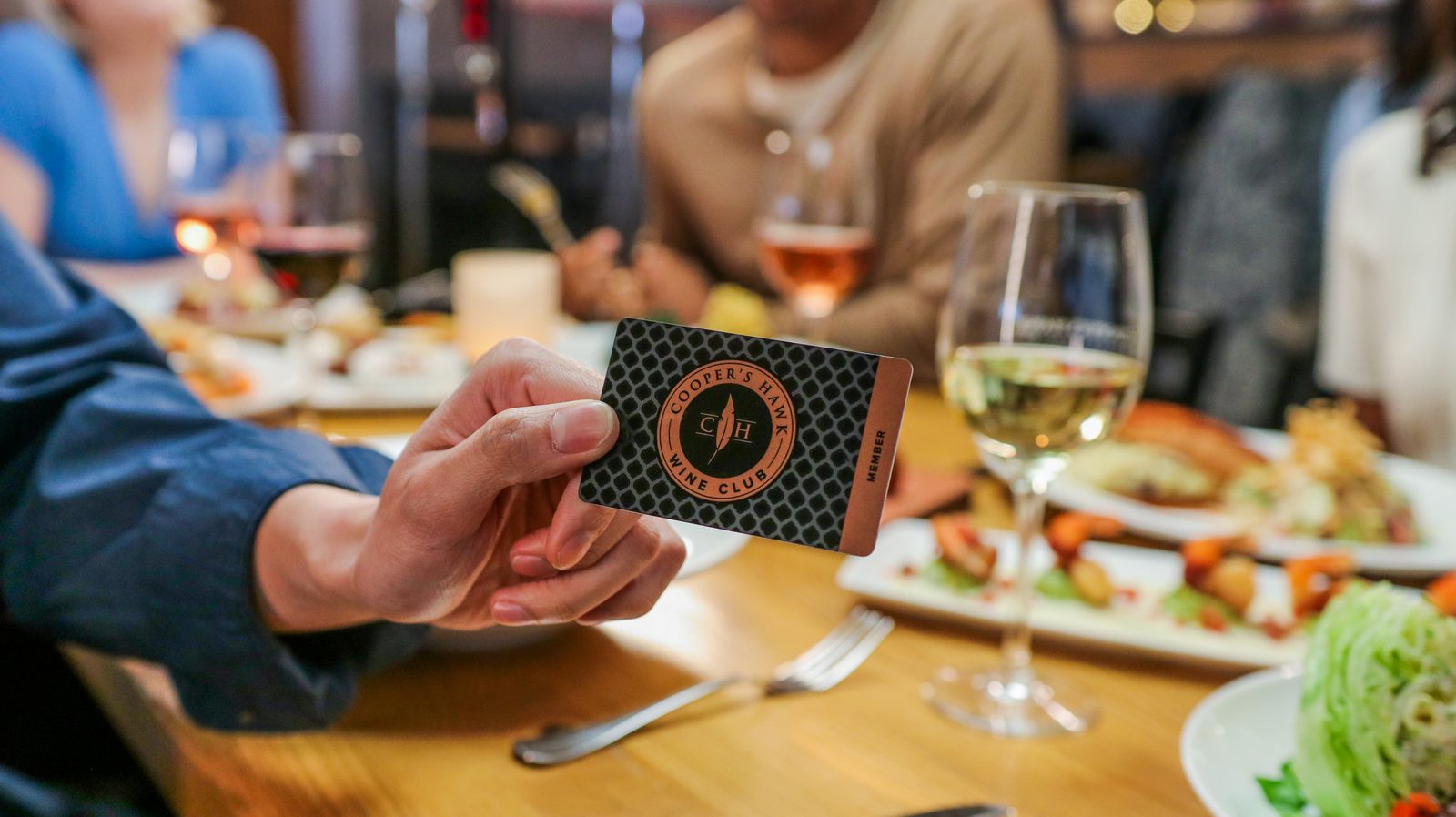 A hand holding a card.