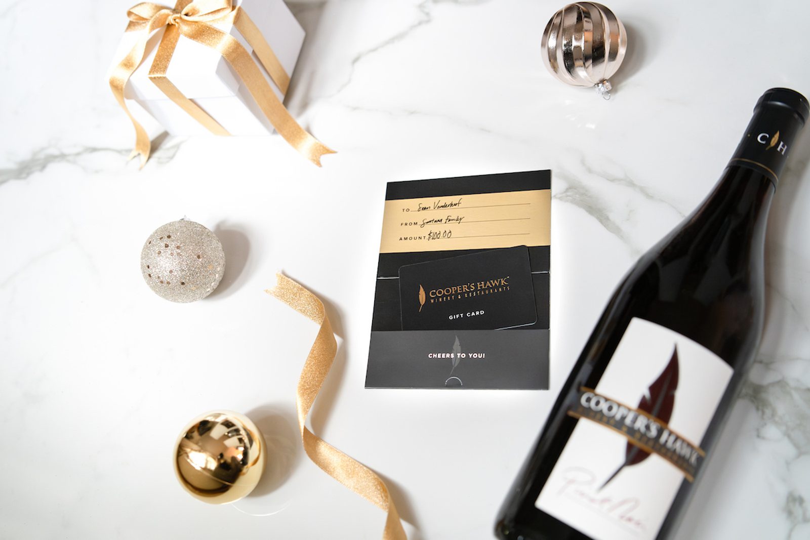 Coopers Hawk Holidays image with gift card and bottle of wine
