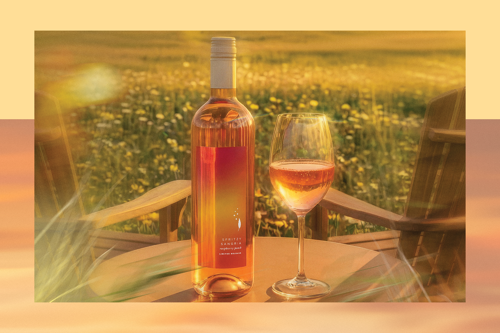 Bottle labeled SPRITZY SANGRIA raspberry peach LIMITED RELEASE and a glass of rosé on a table, wildflower field at sunset