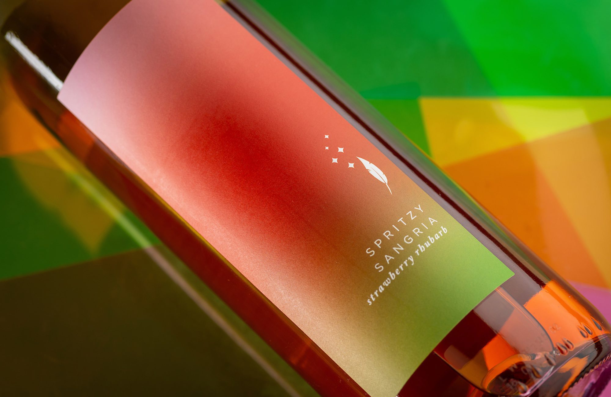 Strawberry Rhubarb Spritzy Sangria Bottle Image with textured background