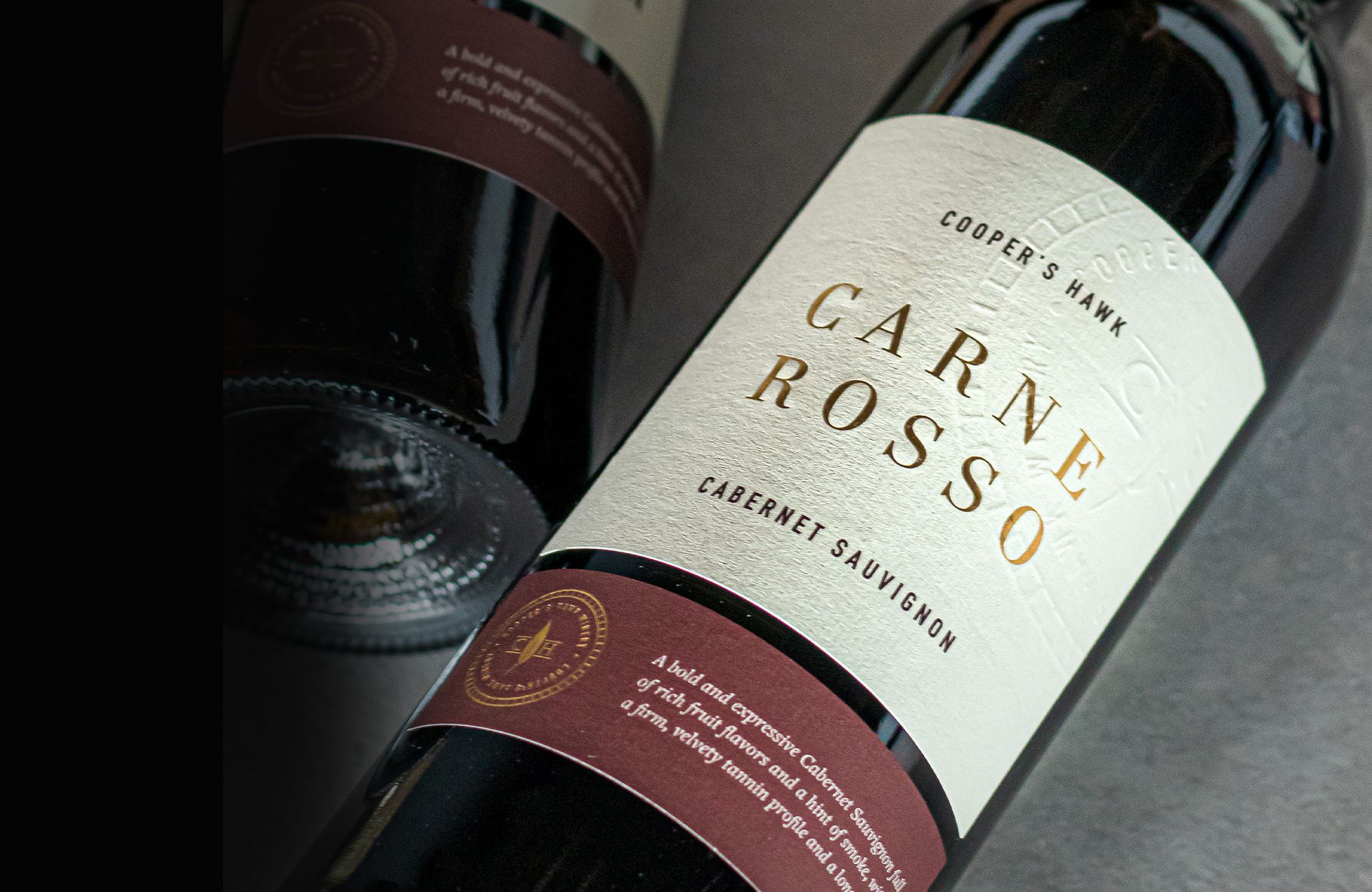 A bottle of carne rosso wine on a table.