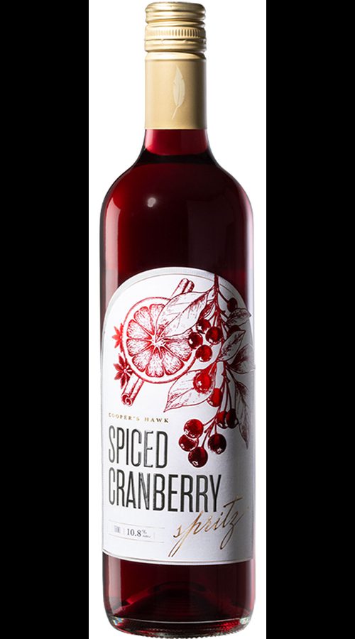 Bottle of Cooper’s Hawk Spiced Cranberry wine with a gold cap and white label featuring red cranberry and citrus artwork on a white background