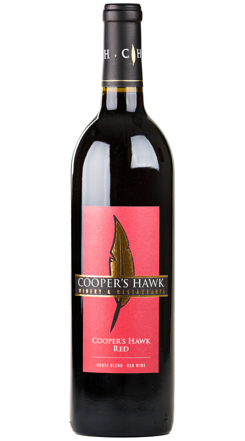 A bottle of Cooper's Hawk Red wine with red label.