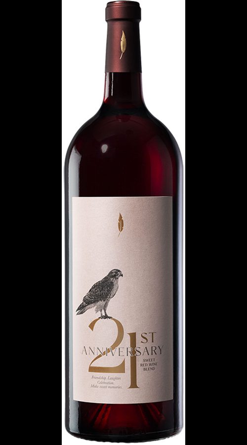 Tall dark red wine bottle with a white label featuring a bird illustration and the text “21st Anniversary” and “Sweet Red Wine Blend”